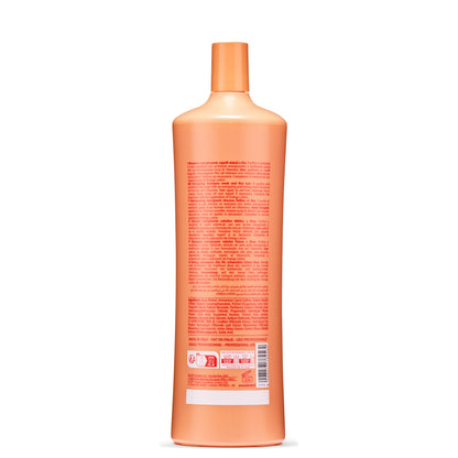 Orange bottle of energizing shampoo for weak and fine hair, made in Italy, with multilingual label and recycling info