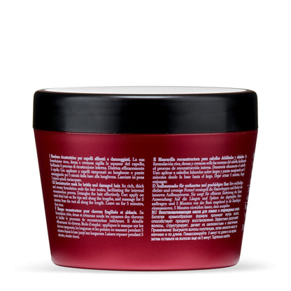 Reconstructive hair mask for brittle and damaged hair in red jar with multilingual instructions