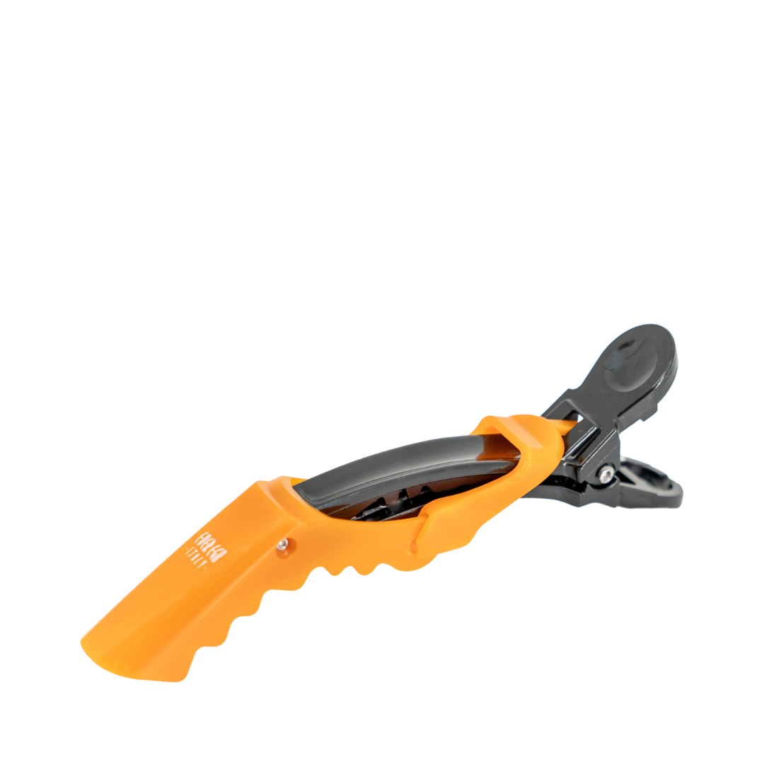 Orange and black hair clipper guard for precise salon styling
