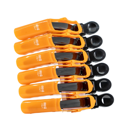 Orange and black hair clips for styling, salon-grade grip tools