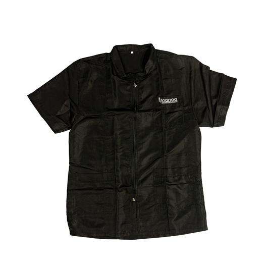 Black short-sleeve beauty salon jacket with zip front and pockets, ideal for estheticians and spa professionals.