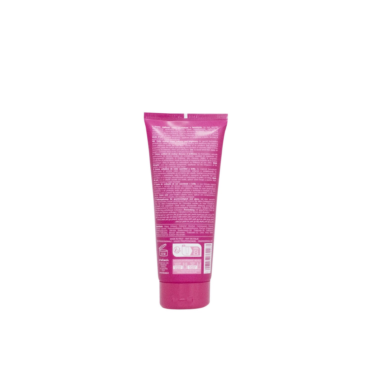 Pink tube of hair color cream with multilingual instructions, made in Italy for salon use
