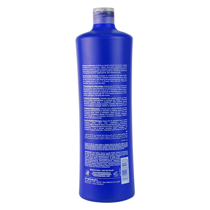 Blue bottle of professional hair shampoo with multilingual instructions, made in Italy for color-treated hair care