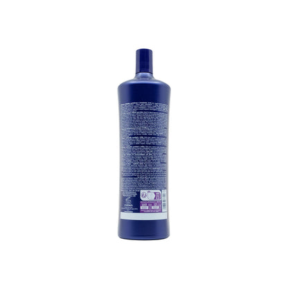 Purple bottle of professional hair care product with multilingual label, made in Italy for blond and bleached hair